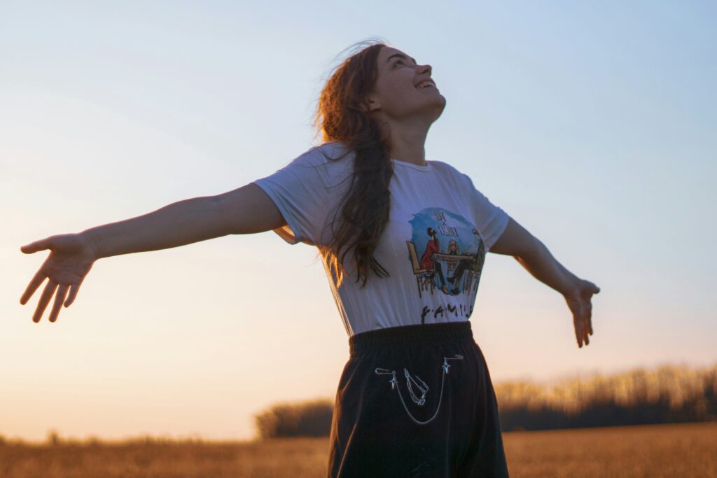 Happy woman with her arms outstretched