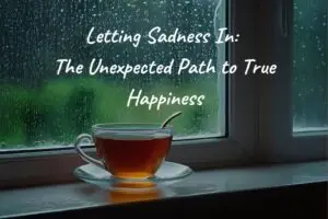 A cup of tea sitting on the windowsill on a rainy day