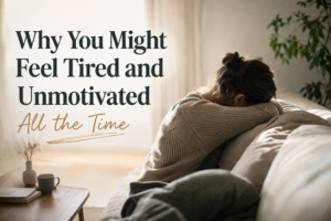 Woman sitting on a couch looking tired and unmotivated in a calm home setting